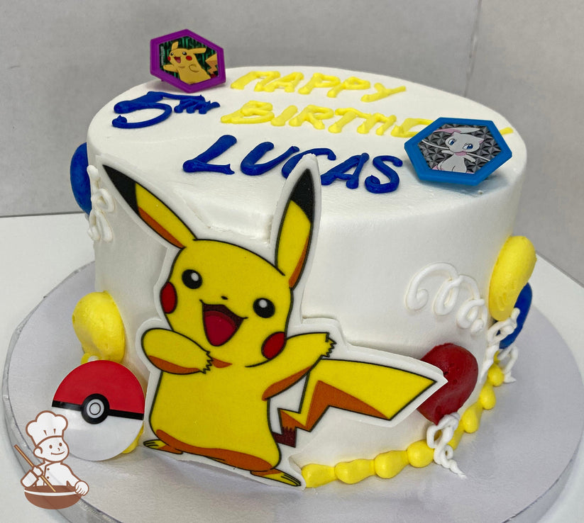 Cake with white icing, decorated with a printed Pikachu in front of the cake, plastic PokÃ©mon-themed rings and festive buttercream balloons.
