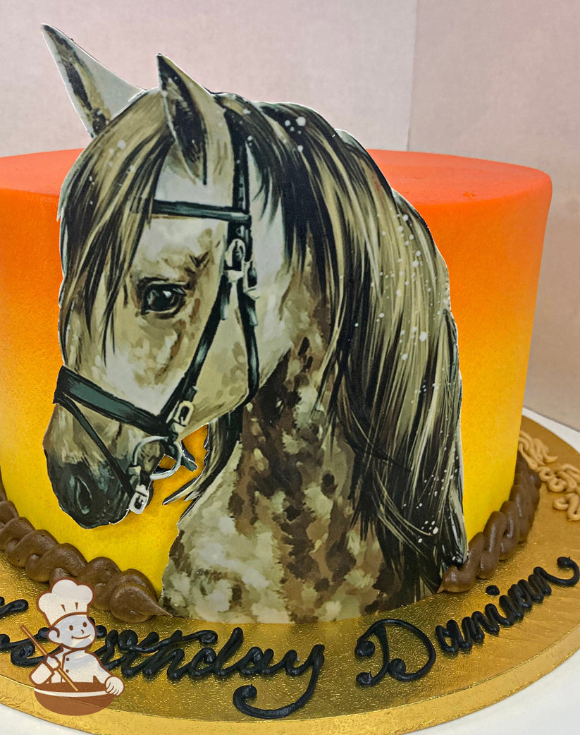 Cake with colored icing to look like a sunset and decorated with an image of a horse in the front of the cake and a buttercream rope trim.