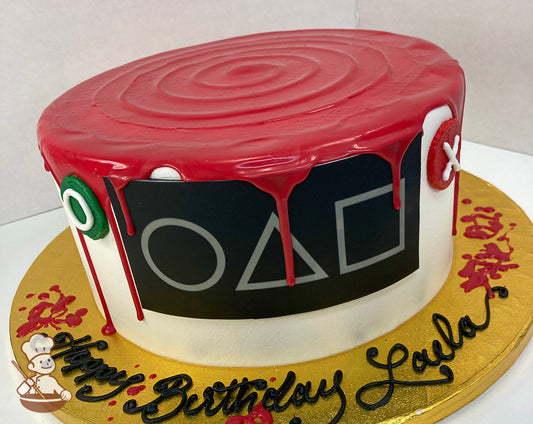 Single tier cake with white icing and decorated with a squid game theme including red drip.