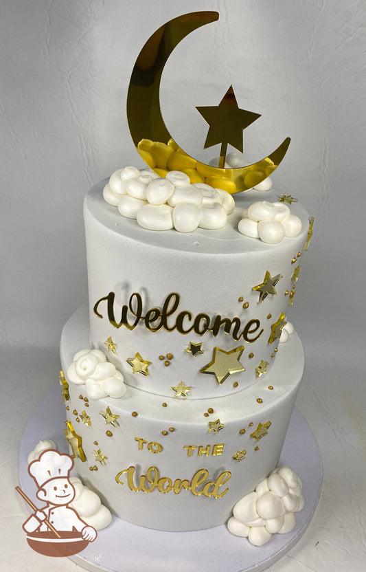 2-tier cake with smooth white icing and plastic gold stars, moon, metallic-gold dots and white fluffy buttercream clouds.