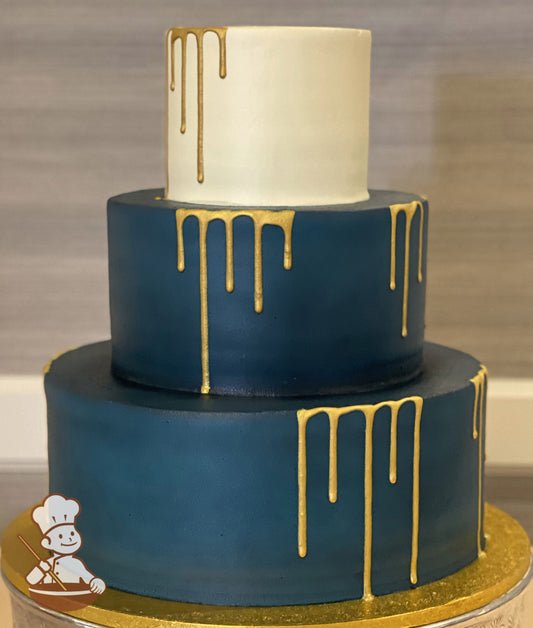 3-tier cake with smooth teal colored icing on the bottom two tiers and smooth ivory colored icing on the top tier and gold drip on all tiers.