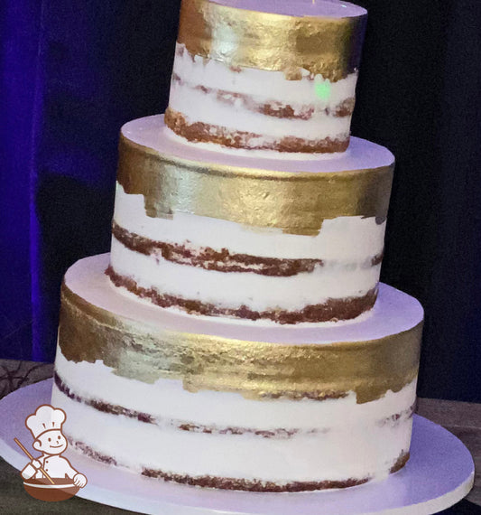 3-tier round cake with white scraped icing to show some of the cake and the top parts of the tiers have been painted gold.