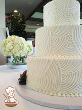 3 Tier wedding cake with vintage piping design.  Puppy figurines added for a whimsical touch.