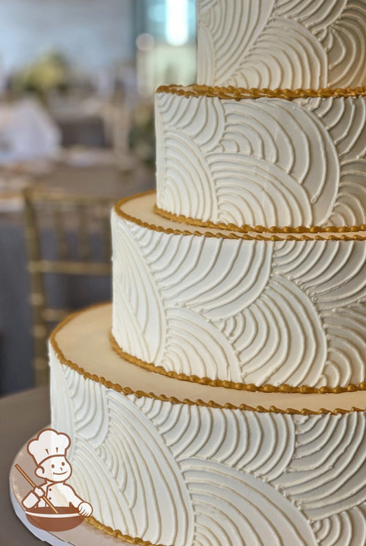 4 tier round wedding cake with buttercream icing and curved vintage piping design and gold piping trim.