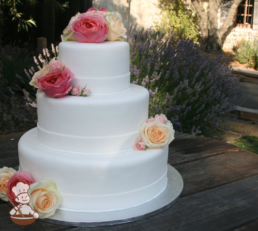 3 tier fondant wedding cake with fondant band wrapped on base of each tier and decorated with fresh roses.