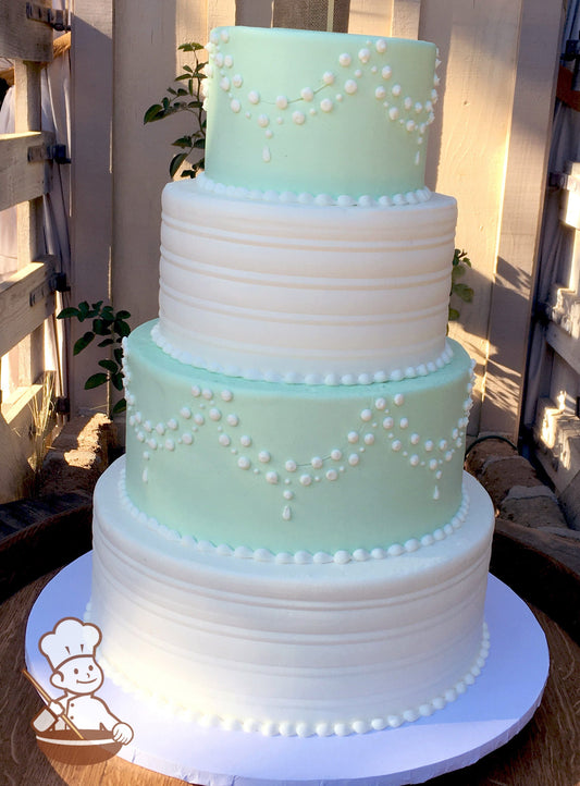 4 tier round wedding cake with alternating seafoam green and white tiers and decorated with elegant bead piping and smooth round lines.