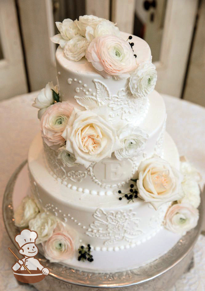 Round 3 tier with brushed buttercream flowers and fondant monogram.  Fresh pastel color roses to finish the cake with a modern & elegant feel.
