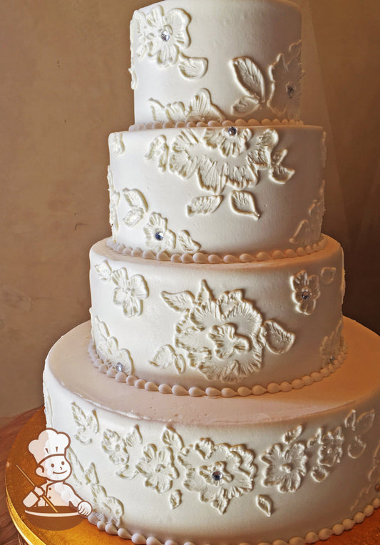 4 tier round wedding cake with brushed buttercream florals adorned with crystal rhinestone center.