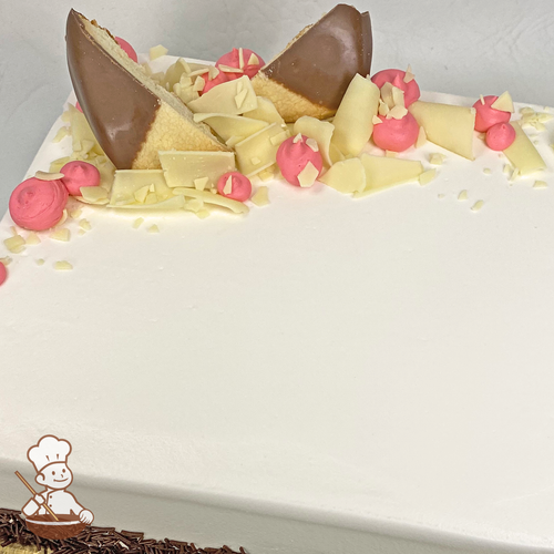 Sheet cake with white chocolate curls and chocolate dipped shortbread cookies with buttercream dollops.