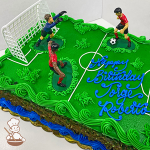 Birthday sheet cake with buttercream soccer field and toy soccer players.