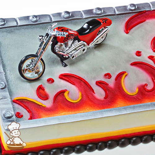 Birthday sheet cake with buttercream flames and chopper bike toy.