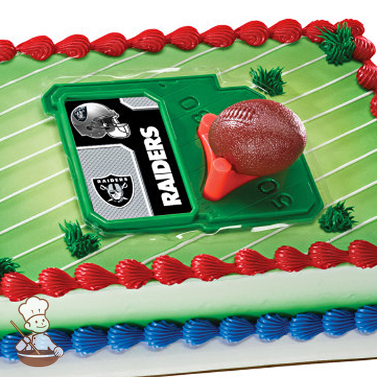 Birthday sheet cake with buttercream football field and NFL Raiders toy.