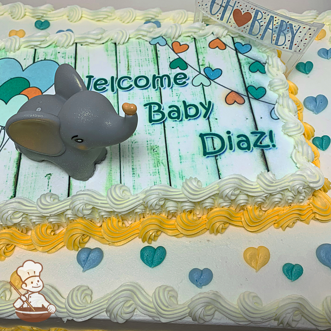 Baby shower sheet cake with toy elephant and Oh Baby banner on photo layer and buttercream hearts.