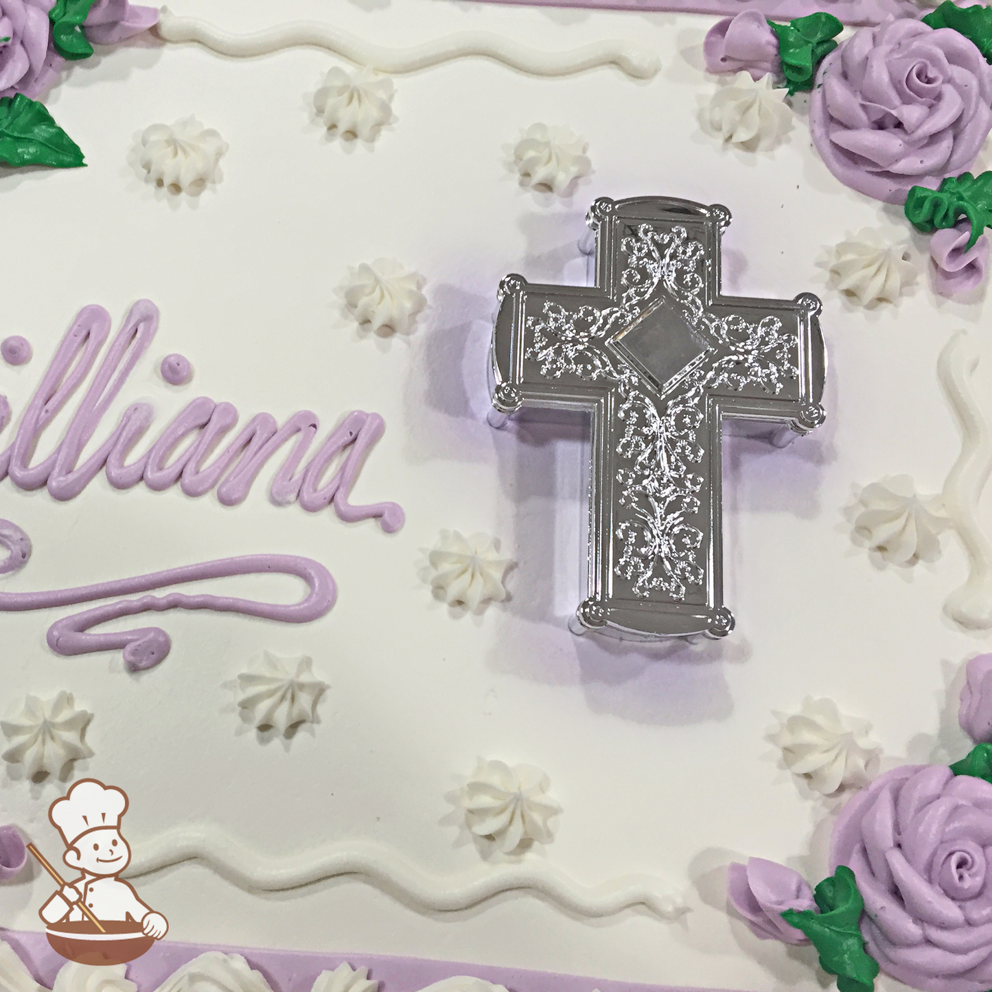 Birthday sheet cake with silver cross toy and buttercream roses.