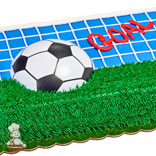 Birthday sheet cake with soccer ball toy and buttercream grass and goal net.