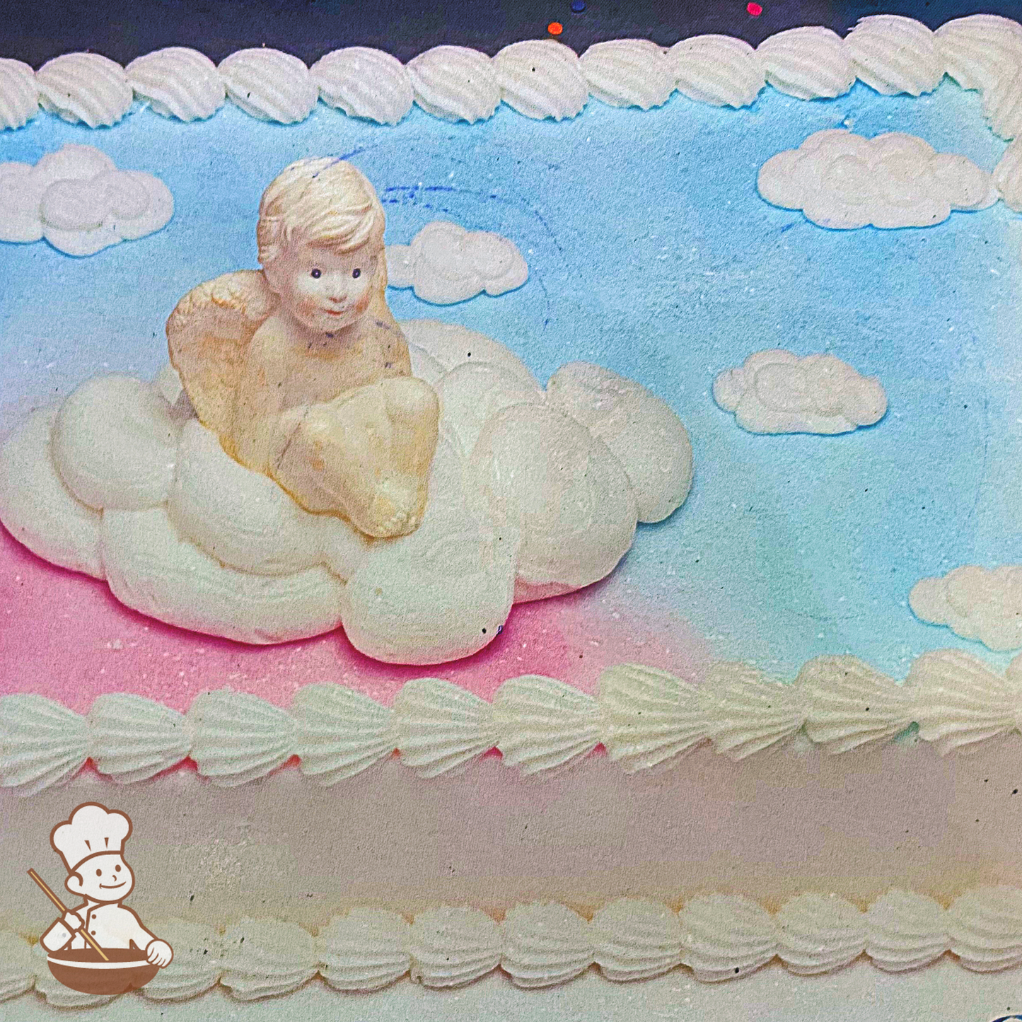 Baptism sheet cake with toy angel and buttercream clouds.